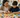 Child and adult sorting learning cards by color, shape, and symbol.
