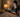 Adult using a tablet in a calm evening bedroom routine.
