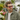 Man wearing red-tinted colour enhancement glasses at a produce market