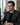 Man wearing eye comfort glasses at a computer
