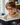 Child wearing reading assistance glasses while reading