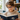 Child wearing reading assistance glasses while reading at home